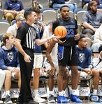 Basketball Showdown: Visual Moments from the Coastal Classic Tip-Off - North Florida vs. Presbyterian College Clash