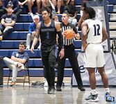 Basketball Showdown: Visual Moments from the Coastal Classic Tip-Off - North Florida vs. Presbyterian College Clash