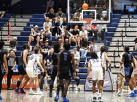 Basketball Showdown: Visual Moments from the Coastal Classic Tip-Off - North Florida vs. Presbyterian College Clash