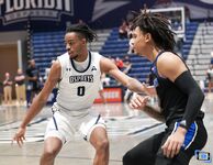 Basketball Showdown: Visual Moments from the Coastal Classic Tip-Off - North Florida vs. Presbyterian College Clash